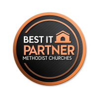 A circular logo with the text "Best IT Partner Methodist Churches" in bold orange and white lettering on a black background. The design features a simple house icon representing a church, highlighted within a modern orange outline.